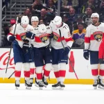 Oct 6, 2026; Los Angeles, California, USA; Florida Panthers left wing Brad Marchand (63) is helped off the ice by left wing Brady Tkachuk (8) and defenseman Niko Mikkola (77) in the third period after an injury against the LA Kings at Crypto.com Arena.