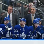 Oct 3, 2026; Toronto, Ontario, CAN; Toronto Maple Leafs head coach Jim Hiller (centre) watches the play against the Ottawa Senators during the third period at Scotiabank Arena.