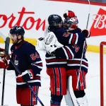 Oct 7, 2026; Winnipeg, Manitoba, CAN; Winnipeg Jets goalie Stuart Skinner (74) is congratulated by forward Mark Scheifele (55) on their win against the Colorado Avalanche at the end of the third period at Canada Life Centre.