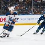 Oct 1, 2026; Vancouver, British Columbia, CAN; Vancouver Canucks forward Liam Ohgren (92) defends against Edmonton Oilers defenseman Evan Bouchard (2) in the third period at Rogers Arena.