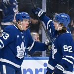 Sep 30, 2026; Toronto, Ontario, CAN; Toronto Maple Leafs forward Easton Cowan (53) celebrates with forward Gavin McKenna (92) after scoring a goal against the New York Islanders in the first period at Scotiabank Arena.