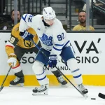 Oct 8, 2026; Las Vegas, Nevada, USA; Toronto Maple Leafs left wing Gavin McKenna (92) gets control of the puck against the Vegas Golden Knights in the first period at T-Mobile Arena.