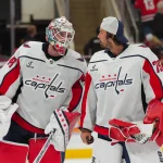 Oct 2, 2026; Raleigh, North Carolina, USA; Washington Capitals goaltender Logan Thompson (48) and goaltender Charlie Lindgren (79) celebrate their victory against the Carolina Hurricanes at Lenovo Center.