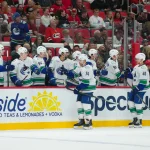 Oct 8, 2026; Raleigh, North Carolina, USA; Vancouver Canucks left wing Jake DeBrusk (74) celebrates his goal against the Carolina Hurricanes during the third period at Lenovo Center.