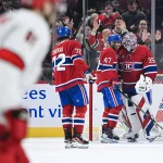Feb 25, 2025; Montreal, Quebec, CAN; Montreal Canadiens goalie Sam Montembeault (35), defenseman Jayden Struble (47) and defenseman Arber Xhekaj (72) celebrate the win against the Carolina Hurricanes after the end of the game at Bell Centre.