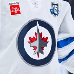 Dec 3, 2025; Montreal, Quebec, CAN; View of a Winnipeg Jets logo on a jersey worn by a member of the team during the first period at Bell Centre.