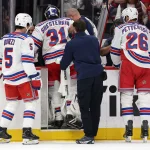 Oct 9, 2026; Washington, District of Columbia, USA; New York Rangers goaltender Igor Shesterkin (31) is helped off the ice after being injured against the Washington Capitals during the second period at Capital One Arena.