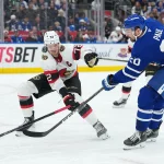 Oct 3, 2026; Toronto, Ontario, CAN; Toronto Maple Leafs left wing Nick Paul (20) battles for the puck with Ottawa Senators defenseman Thomas Chabot (72) during the third period at Scotiabank Arena.
