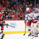 Oct 9, 2026; Washington, District of Columbia, USA; New York Rangers goaltender Igor Shesterkin (31) is helped off the ice after being injured against the Washington Capitals during the second period at Capital One Arena.