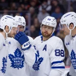 Mar 21, 2026; Ottawa, Ontario, CAN; Toronto Maple Leafs defenseman Pillippe Myers (51) speaks with defenseman Oliver Ekman-Larsson (95) and right wing William Nylander (88) and defenseman Brandon Carlo (25) in the first period against the Ottawa Senators at the Canadian Tire Centre.