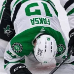Radek Faksa helped off the ice after being hit by a shot in Pittsburgh