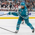 Oct 1, 2026; San Jose, California, USA; San Jose Sharks defenseman Darnell Nurse (25) shoots during the second period against the Florida Panthers at SAP Center at San Jose.