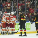 Canucks and Flames linked in trade involving former first-round pick, per Elliotte Friedman Nov 23, 2025; Vancouver, British Columbia, CAN; Calgary Flames center Connor Zary (47) celebrates scoring with left wing Blake Coleman (20) and center Mikael Backlund (11) during the first period against the Calgary Flames at Rogers Arena. Mandatory Credit: Simon Fearn-Imagn Images