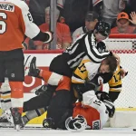 Apr 22, 2026; Philadelphia, Pennsylvania, USA; Pittsburgh Penguins right wing Bryan Rust (17) wrestles with Philadelphia Flyers right wing Travis Konecny (11) during the second period in game three of the first round of the 2026 Stanley Cup Playoffs at Xfinity Mobile Arena.