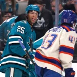 Oct 10, 2026; San Jose, California, USA; San Jose Sharks defenseman Darnell Nurse (25) and Edmonton Oilers right wing Owen Michaels (43) exchange words during a break in the action in the first period at SAP Center in San Jose.