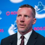 Jun 4, 2026; Vancouver, BC, CANADA; General manager Ryan Johnson speaks in a press conference where the Vancouver Canucks introduce Manny Malhotra as their new head coach at Rogers Arena.