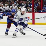 Oct 10, 2026; Denver, Colorado, USA; Toronto Maple Leafs left wing Gavin McKenna (92) skates past Colorado Avalanche defenseman Sam Malinski (70) in the first period at Ball Arena.