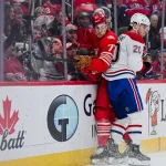 Mar 19, 2026; Detroit, Michigan, USA; Montreal Canadiens left wing Juraj Slafkovsky (20) checks Detroit Red Wings defenseman Simon Edvinsson (77) during the first period at Little Caesars Arena.