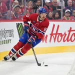 Oct 8, 2026; Montreal, Quebec, CAN; Montreal Canadiens forward Florian Xhekaj (63) plays the puck against the Nashville Predators during the second period at the Bell Centre.