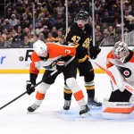 Oct 10, 2026; Boston, Massachusetts, USA; Philadelphia Flyers defenseman Helge Grans (3) and Boston Bruins center Mark Kastelic (47) battle for a rebound in front of goaltender Dan Vladar (80) during the third period at TD Garden.