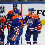 Jun 14, 2025; Edmonton, Alberta, CAN; Edmonton Oilers center Connor McDavid (97) celebrates scoring with defenseman Mattias Ekholm (14) and center Leon Draisaitl (29) and defenseman Evan Bouchard (2) during the third period against the Florida Panthers in game five of the 2025 Stanley Cup Final at Rogers Place.