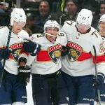 Oct 6, 2026; Los Angeles, California, USA; Florida Panthers left wing Brad Marchand (63) is helped off the ice by left wing Brady Tkachuk (8) and defenseman Niko Mikkola (77) in the third period after an injury against the LA Kings at Crypto.com Arena