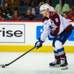 Oct 8, 2026; Calgary, Alberta, CAN; Colorado Avalanche defenseman Cale Makar (8) controls the puck against the Calgary Flames during the third period at Scotiabank Saddledome.