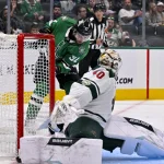 Sep 23, 2025; Dallas, Texas, USA; Minnesota Wild goaltender Cal Petersen (40) stops a shot by Dallas Stars center Harrison Scott (37) during the second period at American Airlines Center.