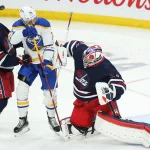 Sabres push for blockbuster Connor Hellebuyck trade involving Rangers in three-team deal Dec 14, 2021; Winnipeg, Manitoba, CAN; Winnipeg Jets goalie Connor Hellebuyck (37) makes a save as Winnipeg Jets defenseman Josh Morrissey (44) jostles for position with Buffalo Sabres forward Rasmus Asplund (74) during the third period at Canada Life Centre. Mandatory Credit: Terrence Lee-USA TODAY Sports