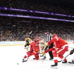 Oct 26, 2023; Boston, Massachusetts, USA; Detroit Red Wings center Dylan Larkin (71) and Boston Bruins center Pavel Zacha (18) battle for the puck during the first period at TD Garden.