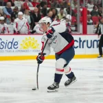 Oct 13, 2026; Raleigh, North Carolina, USA; Washington Capitals right wing Ryan Leonard (9) takes a shot against the Carolina Hurricanes during the second period at Lenovo Center.