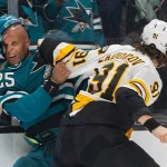 Oct 13, 2026; San Jose, California, USA; San Jose Sharks defenseman Darnell Nurse (25) and Boston Bruins defenseman Nikita Zadorov (91) fight during the third period at SAP Center at San Jose.