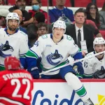 Oct 8, 2026; Raleigh, North Carolina, USA; Vancouver Canucks center Aatu Raty (54 looks on from the players bench against the Carolina Hurricanes during the third period at Lenovo Center.