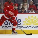 Oct 13, 2026; Detroit, Michigan, USA; Detroit Red Wings center Dylan Larkin (71) skates with the puck in the second period against the New Jersey Devils at Little Caesars Arena.