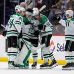 Oct 14, 2026; Denver, Colorado, USA; Dallas Stars goaltender Casey DeSmith (1) celebrates with center Roope Hintz (24) and center Radek Faksa (12) and center Justin Hryckowian (49) after the game against the Colorado Avalanche at Ball Arena.