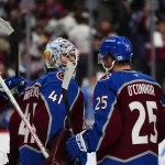 Apr 16, 2026; Denver, Colorado, USA; Colorado Avalanche goaltender Scott Wedgewood (41) and right wing Logan O'Connor (25) celebrate the win over the Seattle Kraken in the second period at Ball Arena.