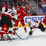 Oct 6, 2026; Detroit, Michigan, USA; Ottawa Senators right wing Drake Batherson (19) tries to score a goal on Detroit Red Wings goaltender John Gibson (36) with assistance from left wing William Eklund (27) during the third period at Little Caesars Arena. Mandatory Credit: Brian Bradshaw Sevald-Imagn Images
