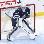 Oct 11, 2025; Winnipeg, Manitoba, CAN; Winnipeg Jets goaltender Connor Hellebuyck (37) warms up before a game against the Los Angeles Kings at Canada Life Centre.