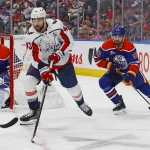 Jan 24, 2026; Edmonton, Alberta, CAN; Washington Capitals forward Tom Wilson (43) looks to make a pass in front of Edmonton Oilers defensemen Jake Wahlman (96) during the second period at Rogers Place.