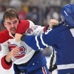 Sep 19, 2026; Toronto, Ontario, CAN; Montreal Canadiens defenseman Florian Xhekaj (63) fights with Toronto Maple Leafs defenseman Marshall Rifai (83) in the second period at Scotiabank Arena.