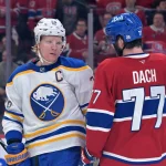 10 mai 2026 ; Montréal, Québec, Canada ; le défenseur des Sabres de Buffalo Rasmus Dahlin (26) et l'attaquant des Canadiens de Montréal Kirby Dach (77) échangent quelques mots durant la deuxième période du troisième match du deuxième tour des séries éliminatoires de la Coupe Stanley 2026, au Centre Bell.