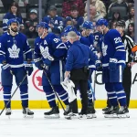Oct 15, 2026; Toronto, Ontario, CAN; Toronto Maple Leafs center John Tavares (91) is helped off the ice by defenseman Jake McCabe (22) against the Buffalo Sabres during the third period at Scotiabank Arena