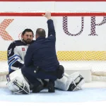 Mar 21, 2026; Pittsburgh, Pennsylvania, USA; Winnipeg Jets goaltender Connor Hellebuyck (37) is looked at by team trainer after a collision with a Pittsburgh Penguins during the third period at PPG Paints Arena.