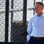 Detroit Tigers chairman and CEO Chris Ilitch watches practice during spring training at TigerTown in Lakeland, Fla. on Tuesday, Feb. 20, 2024.
