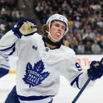 Oct 13, 2026; Salt Lake City, Utah, USA; Toronto Maple Leafs left wing Gavin McKenna (92) celebrates a goal against the Utah Mammoth during the third period at Delta Center.