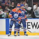 Oct 3, 2026; Edmonton, Alberta, CAN; Edmonton Oilers center Connor McDavid (97) and center Leon Draisaitl (29) celebrate a goal on the Seattle Kraken during the third period at Rogers Place.