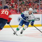 Oct 15, 2026; Sunrise, Florida, USA; Vancouver Canucks center Elias Pettersson (40) moves the puck against the Florida Panthers during the third period at Amerant Bank Arena.