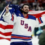 Feb 22, 2026; Milan, Italy; Connor Hellebuyck (37) of the United States celebrates after defeating Canada in the men's ice hockey gold medal game during the Milano Cortina 2026 Olympic Winter Games at Milano Santagiulia Ice Hockey Arena.