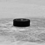 Sep 23, 2026; Dallas, Texas, USA; A view of an NHL puck and the Dallas Stars logo during the second period between the Dallas Stars and the Minnesota Wild at the American Airlines Center.