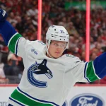 Oct 15, 2026; Sunrise, Florida, USA; Vancouver Canucks defenseman Elias Pettersson (25) celebrates after scoring against the Florida Panthers during the first period at Amerant Bank Arena